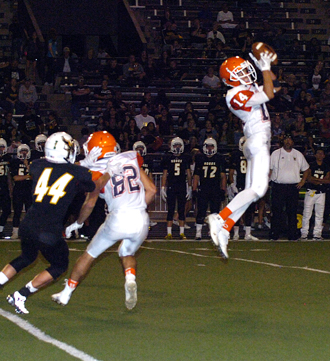 Cody Fuentes skies to nab a deflected pass. (Brienne Green - Daily Press)