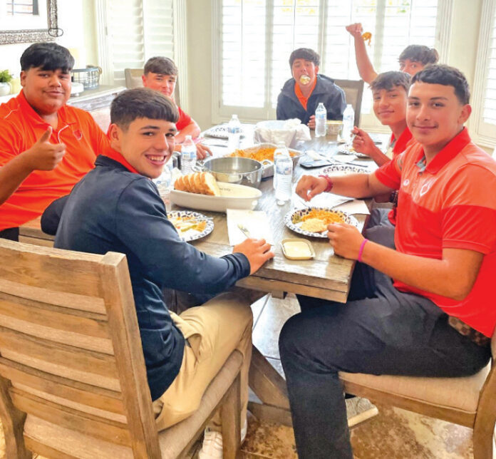 Courtesy Photo Curtis Tolle’s Quarterback Sons Diego Lopez, Devyn Velasquez, Izac Cazares and Rafael Orozco and their friends meet for a meal at Tolle’s home. Pictured are, from left, Velasquez, Lopez, Caleb Murray, Cazares, Frankie Galindo, Kaden Beauregard and Orozco.