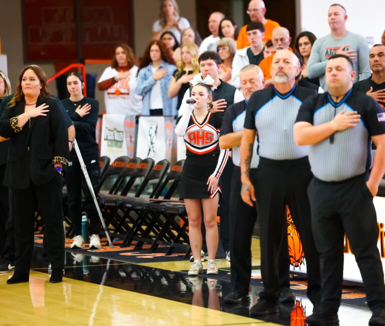 Freshman cheerleader sings national anthem
