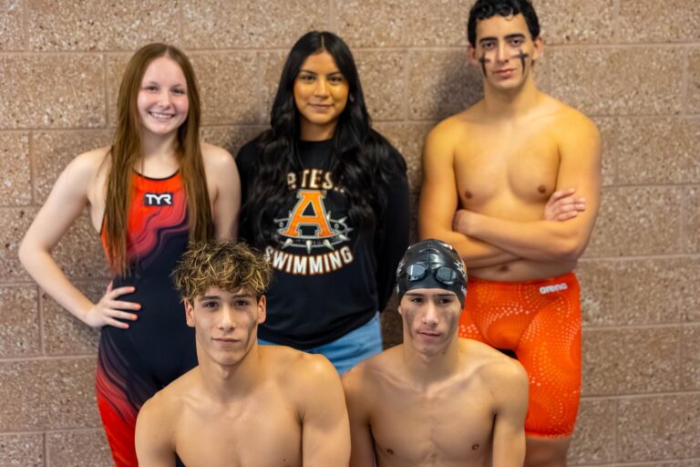 Swim team wins invitational on Senior Day