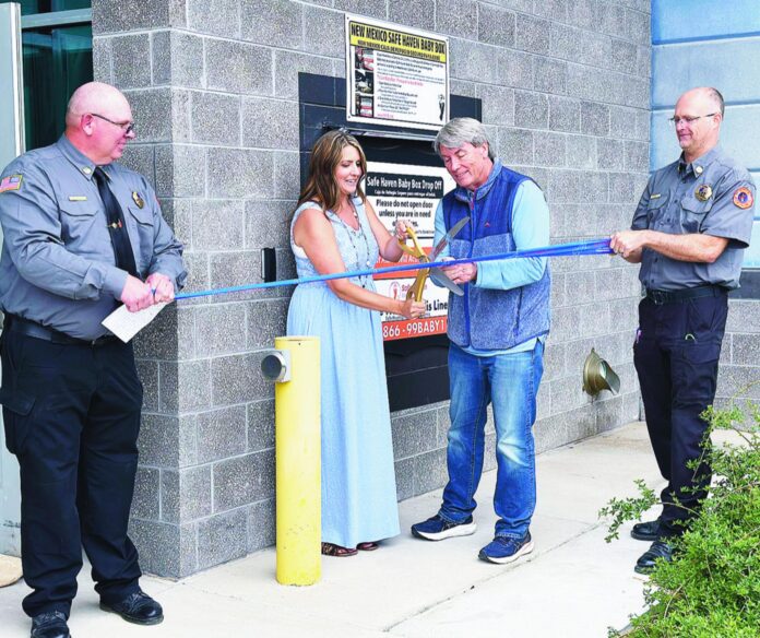(Left to right) Jessi Getrost, executive assistant for Monica Kelsey, CEO and founder of Safe Haven Baby Boxes, and Lovington Mayor Robbie Roberts cut the ribbon Monday afternoon marking the opening of Lea County’s second Baby Box.