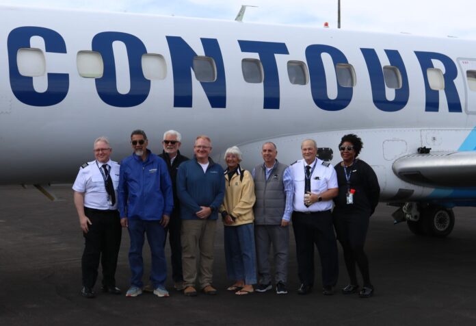 Officials gathered to celebrate the arrival of Contour Airlines at Sierra Blanca Regional Airport on May 5 were (l-r) Contour pilot Jeff Reeder, Ruidoso Village Councilor Rifle Salas, Mayor Lynn Crawford, councilors Darren Hooker and Susan Lutterman, Village Manager Ron Sena, Contour assistant chief pilot Randall Gay and flight attendant Sherita Caldwell.