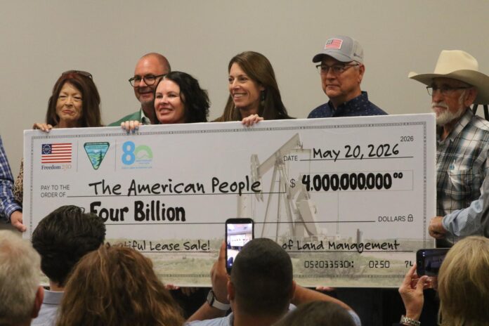 (left to right) New Mexico. Sen. Candy Spence-Ezzell, Carlsbad City Administrator Wendy Austin and Deputy Interior Secretary Kat MacGregor pose with a $4 billion check, May 20, 2026 in Carlsbad.