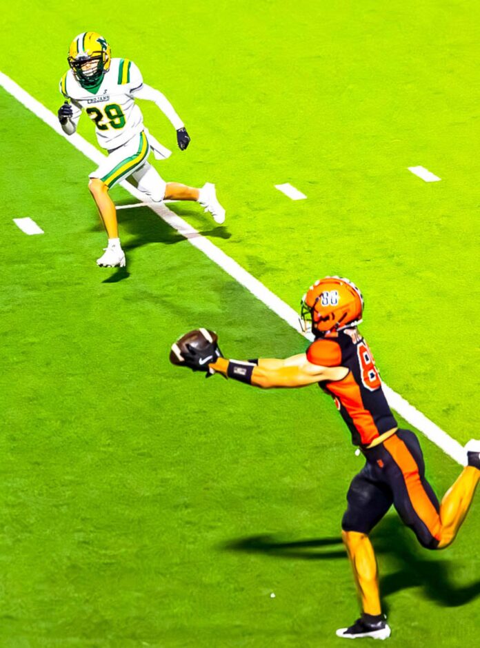 Artesia wide receiver Jack Byers makes a touchdown catch against Mayfield during a game at the Bulldog Bowl.
