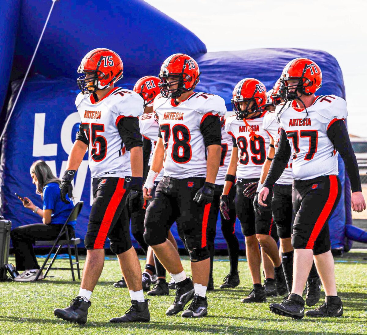 The Artesia football team heads back onto the field after halftime during a game against Lovington.