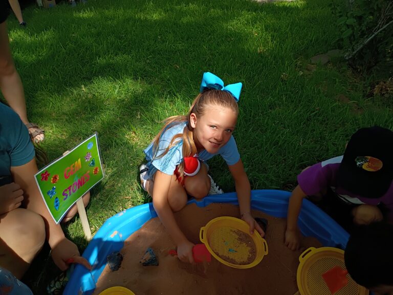 Artesia Museum transforms into dinosaur garden as children head outdoors during the summer reading program for bone dig