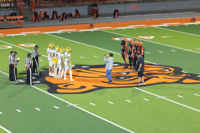 The Bulldogs wait for the coin toss against Mayfield.
