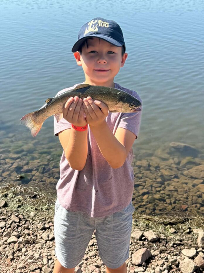 Liam Toya caught his limit of rainbow trout using Garlic and Salmon Peach PowerBait on Aug. 1, 2026 at Eagle Nest Lake in northern New Mexico.