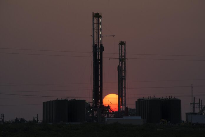 Drilling rigs operate in the Permian Basin.