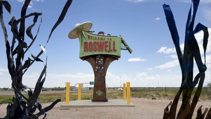 A UFO-themed sign welcomes visitors to Roswell.