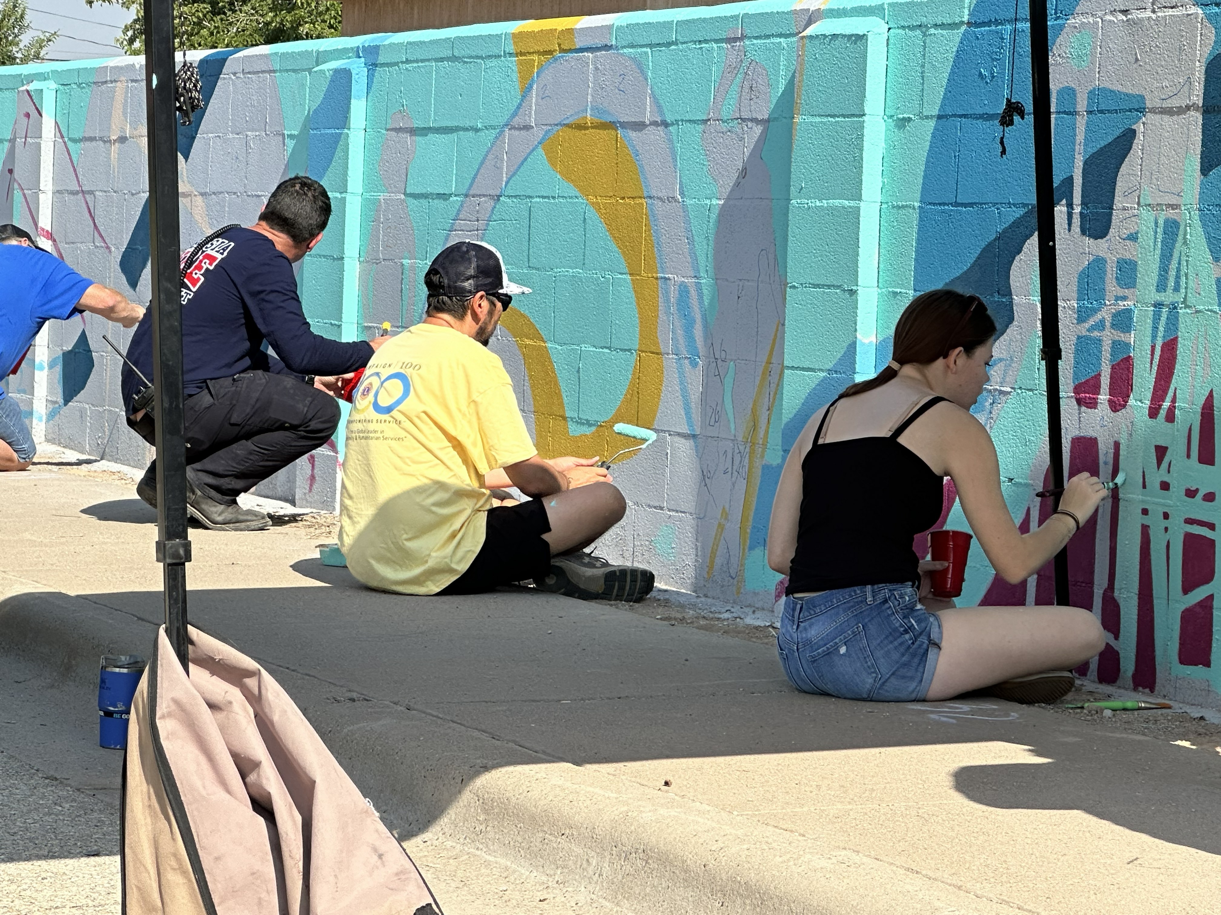 Mayor, firefighters’ brave late morning heat for mural painting Friday. Here is a photographic update