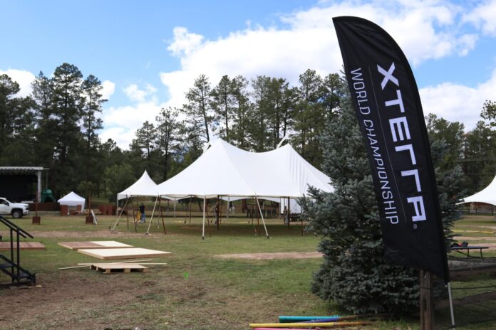 XTERRA and Village of Ruidoso personnel work to set up tents on Monday, Oct. 5, ahead of the triathlon event starting on Thursday, Oct. 8, based out of Wingfield Park.