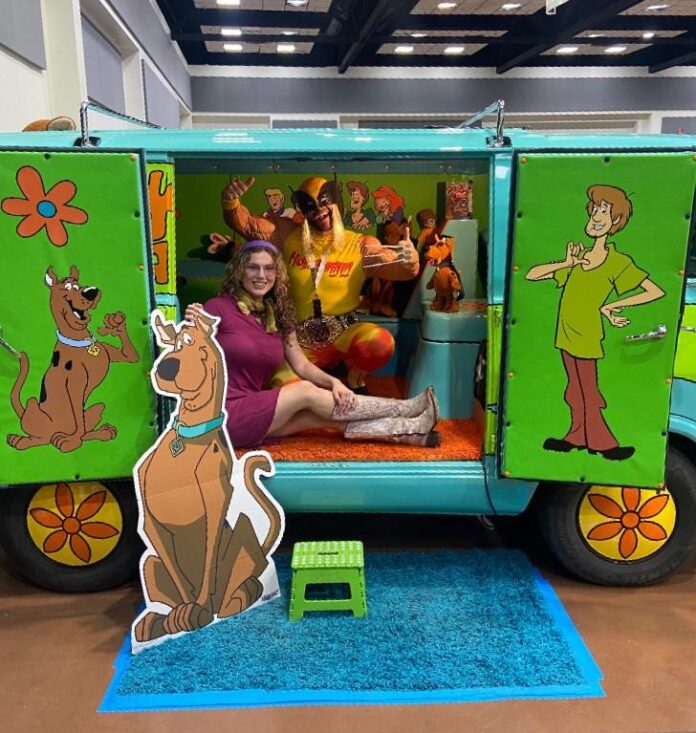 Logan Fleharty as Wolverine and Alison Bird as Daphne pose in the Mystery Machine during the R2Doso Con on Oct. 24-25, 2025, at the Ruidoso Convention Center.